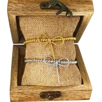 Elastische rvs armband met strik goud of zilver