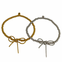 Elastische rvs armband met strik goud of zilver
